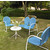 Crosley Furniture Griffith 4 Piece Metal Outdoor Conversation Seating Set - Loveseat & 2 Chairs in Sky Blue Finish with Side Table in White Finish