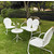 Crosley Furniture Griffith 4 Piece Metal Outdoor Conversation Seating Set - Loveseat & 2 Chairs in White Finish with Side Table in White Finish