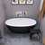 ALFI brand Oval Solid Surface Resin Soaking Bathtub, 59'' Black / White Bathtub Lifestyle View