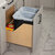 Hardware Resources CDM-WBMD3521 Series White Birch Wood Bottom-Mount Soft-Close Trash Can Rollout with Double 35 Quart Waste Bins For Door Mounting, Base Unit w/ Black Bin In Use Kitchen Side View