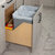 Hardware Resources CDM-WBMD3521 Series White Birch Wood Bottom-Mount Soft-Close Trash Can Rollout with Double 35 Quart Waste Bins For Door Mounting, Base Unit w/ Grey Bin In Use Kitchen Side View