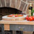 John Boos Pizza Lover Basket Gift Pack, 7-Piece with R18 Northern Hard Rock Maple Cutting Board, In Use Illustration