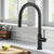 KRAUS Oletto™ Modern Industrial Pull-Down Single Handle Kitchen Faucet, Matte Black, In Use Illustration