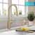 Kraus Brushed Gold Tall Oletto Kitchen Faucet Lifestyle View 2