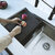 Stylish International Workstation Sink Black Cutting Board, BPA-Free, Food-Grade Polymer, 11'' W x 16-7/8'' D x 3/8'' Thick, In Use Kitchen Overhead View