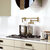 Whitehaus Vintage III Plus Wall Mounted Retractable Spout Pot Filler with Lever Handles, Antque Brass, Installed View